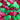 Red and green gummy candies shaped like frogs.